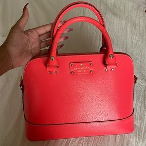 Kate Spade Top Handle Handbag with Crossbody Strap in a Bright Flamingo Pink.